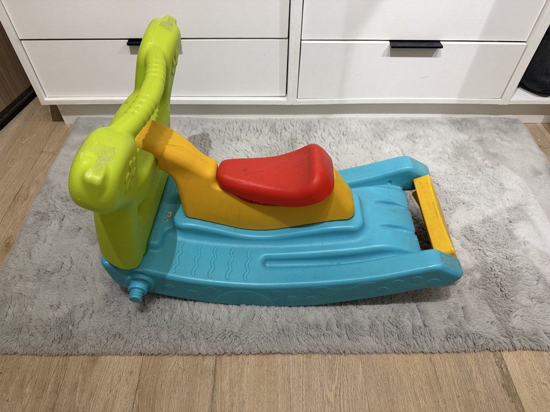 Colorful Rocking Horse (Category: Infant Playtime) located in Paranaque City. Submitted by kyvn19 (Listing ID 1437721742, Image 3). Description: - Toddler-friendly rockingchair and slide - Bright colors: blue base, yellow seat, red seat, green handle - Designed with a sturdy base for safe rocking - Fun and engaging toy for young children.