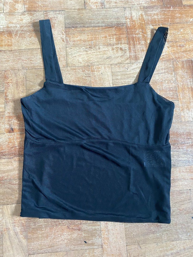 Cotton On Black Tank Top S (Category: Sleeveless) located in Manila. Submitted by boomboomshakataka (Listing ID 1437664647, Image 1). Description: - Cotton On black tank top - Size: S - Features a square neckline - Wide straps - Solid black color - Lightweight material - Made in China.
