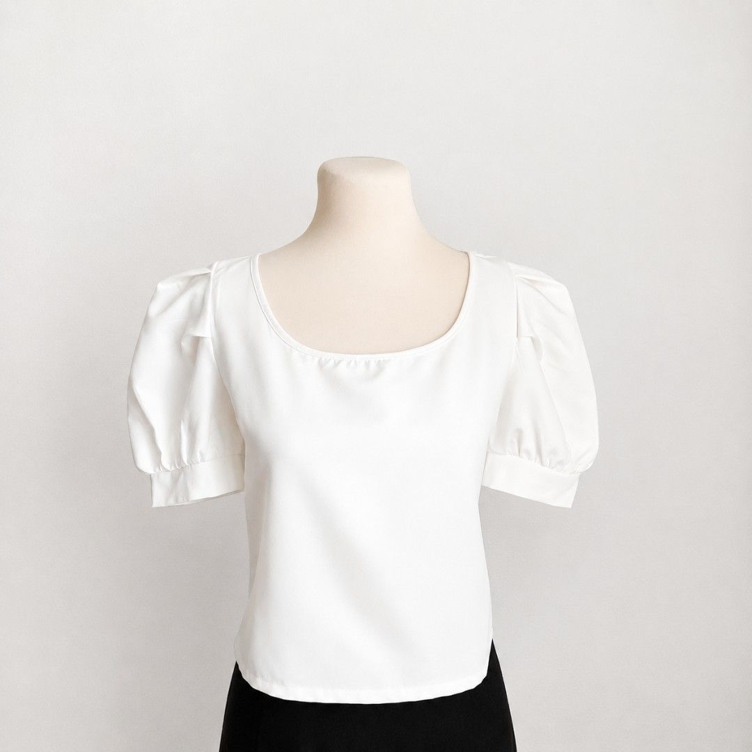 Cream White Square Neck Puff Sleeve Blouse (Category: Blouses) located in Manila. Submitted by ixshibixi (Listing ID 1437647358, Image 1). Description: Very good condition Cream white color in actual Black ribbon tie back Fits M-L Width: 18 inches Length: 18 inches Perfect for a chic, feminine look.