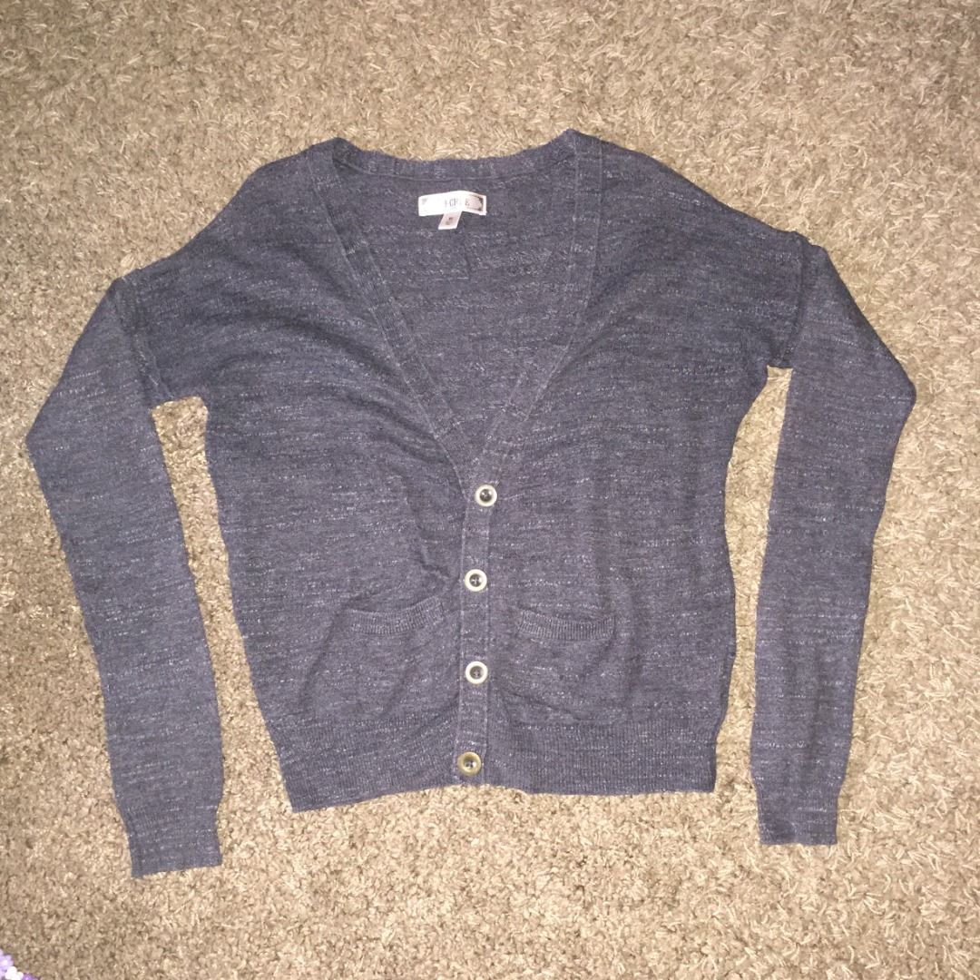 [DECREE] Charcoal Gray Button-Up Cardigan Sweater (Category: Coats, Jackets and Outerwear) located in Batac City. Submitted by achi.aia (Listing ID 1437639834, Image 1). Description: Brand: Decree Material: 100% cotton Design Features: - Heathered or marled knit texture - Standard four-button front closure - Ribbed detailing at the cuffs and hem - Two open patch pockets near the waist.