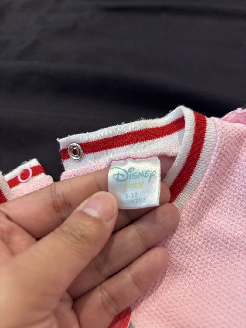 Disney Baby Minnie Mouse Dress Set (Category: Babies & Kids Fashion) located in General Trias. Submitted by irncstnd (Listing ID 1437600675, Image 2). Description: - Adorable baby dress set. - Features a pink dress with Minnie Mouse design. - Includes matching bloomers. - Dress has ruffled sleeves and 'Love Minnie' print. - Designed for babies aged 6-12 months. - Dress has red and white trim. - Made of textured fabric..