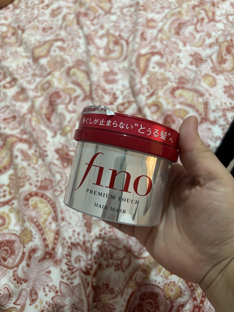 Fino Premium Touch Hair Mask (Category: Hair) located in Iba. Submitted by rcgpreloves (Listing ID 1437619089, Image 1). Description: - Fino Premium Touch Hair Mask - Premium hair care solution - Features a silver container with red accents - Contains Japanese text on the label - Designed for effective hair care.