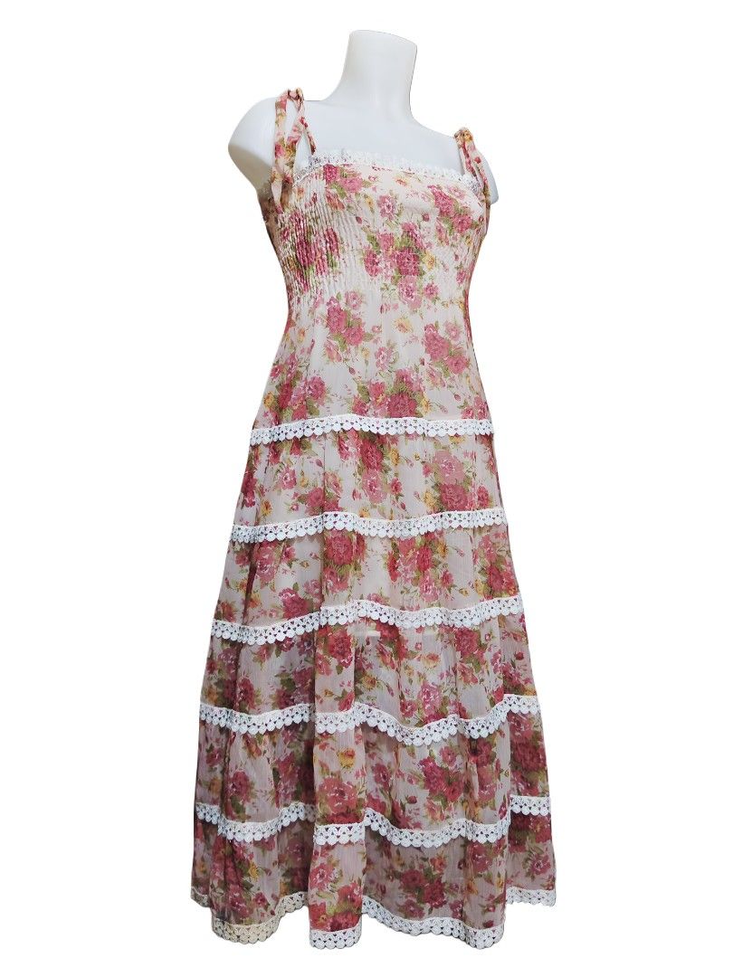 floral tiered dress (Category: Dresses) located in Manila. Submitted by hezzy.ph (Listing ID 1437633263, Image 1). Description: Stunning floral dress with a tiered design, square neckline, and adjustable straps. Features a smocked bodice and lace detailing. Fits XS to L Bust: 28"-34" Waist: up to 34" Length: 45".