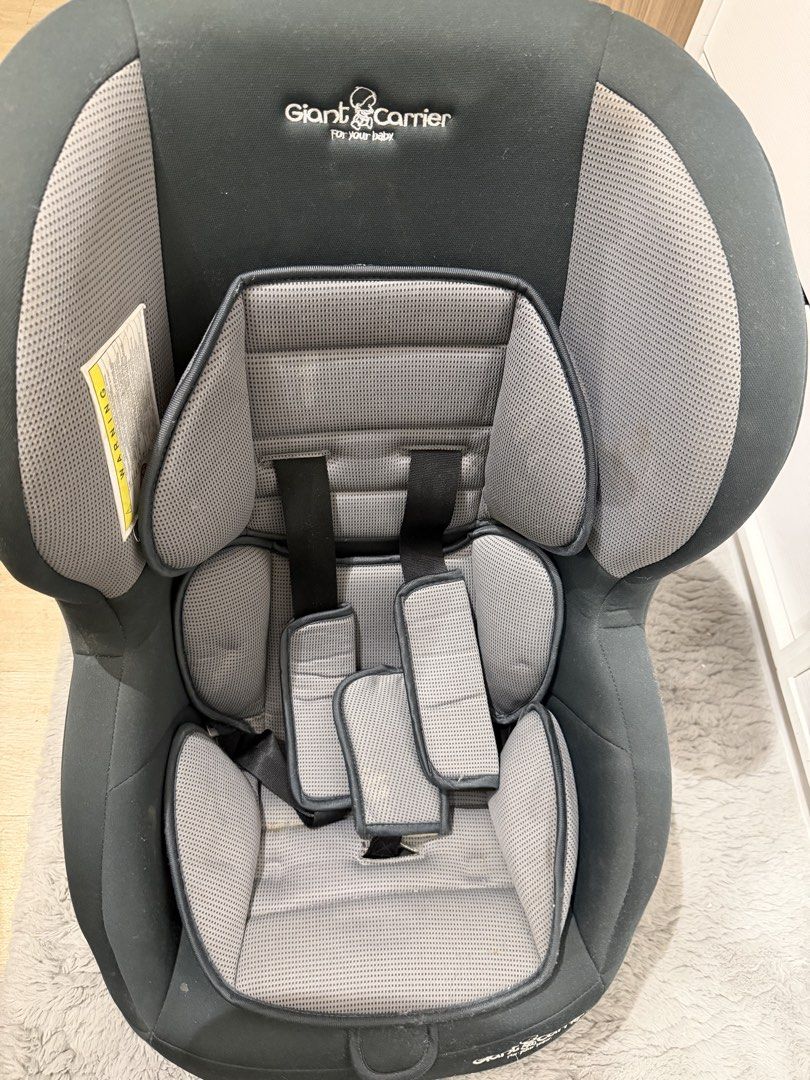 Giant Carrier Car Seat (Category: Car Seats) located in Paranaque City. Submitted by kyvn19 (Listing ID 1437721135, Image 1). Description: - Giant Carrier car seat - Dark grey color - Padded seat and headrest - Adjustable straps - Sturdy base for secure installation.