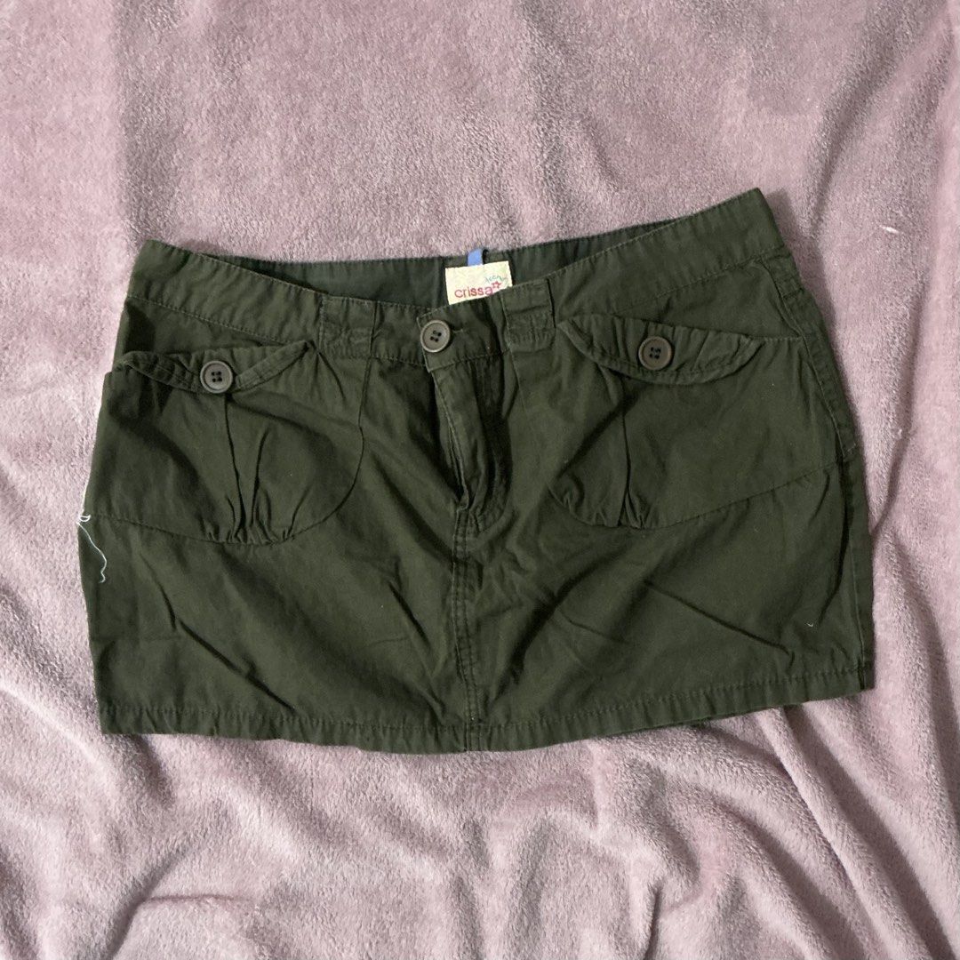 Green Mini Skirt with Embroidery (Category: Skirts) located in Manila. Submitted by fierceriver.238b8c (Listing ID 1437656400, Image 2). Description: - Dark green mini skirt - Front pockets and button details - Embroidered floral design on the back - Two back pockets - Classic, casual style - Durable fabric.