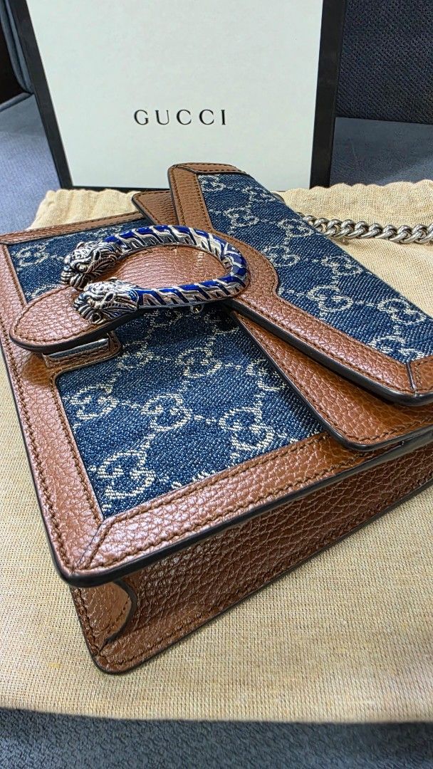 Gucci Dionysus Denim Shoulder Bag (Category: Luxury Bags & Wallets) located in Taguig. Submitted by yaneegirl_118 (Listing ID 1437698153, Image 2). Description: - Authentic Gucci Dionysus shoulder bag - Denim GG Supreme canvas with brown leather trim - Features chain strap - Iconic tiger head closure - Includes original box, dust bag, and authenticity cards - Stylish and recognizable design - used twice only - money back guarantee.