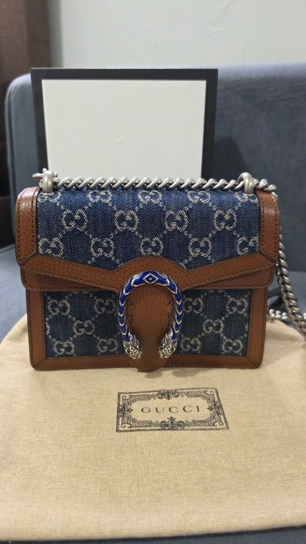Gucci Dionysus Denim Shoulder Bag (Category: Luxury Bags & Wallets) located in Taguig. Submitted by yaneegirl_118 (Listing ID 1437698153, Image 1). Description: - Authentic Gucci Dionysus shoulder bag - Denim GG Supreme canvas with brown leather trim - Features chain strap - Iconic tiger head closure - Includes original box, dust bag, and authenticity cards - Stylish and recognizable design - used twice only - money back guarantee.