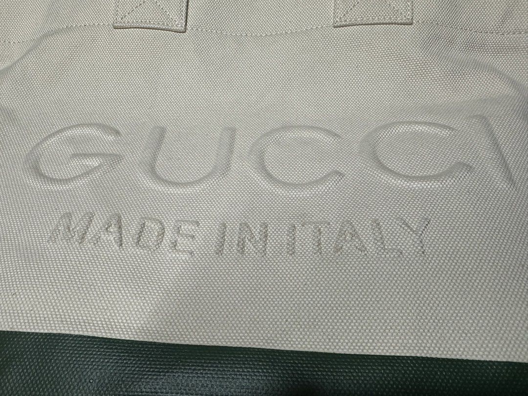 Gucci Tote Bag Ophidia (Category: Luxury Bags & Wallets) located in Butuan. Submitted by natalday (Listing ID 1437706790, Image 2). Description: - Authentic Gucci tote bag - Cream canvas body - Embossed Gucci logo - Green and red stripe detail - Two top handles - Zipper closure - Made in Italy GUCCI Canvas Logo Embossed Ophidia Tote in Beige. This stylish tote is finely crafted of canvas in beige and features red and green web striping. The top i