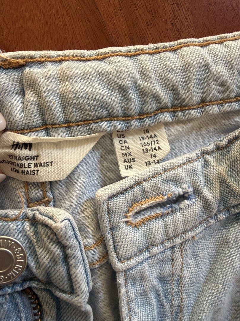 H&M Straight Adjustable Waist Jeans (Category: Jeans) located in Makati City. Submitted by larcie (Listing ID 1437612716, Image 2). Description: - H&M straight jeans - Adjustable waist - Unique patchwork design - Different shades of blue denim - Low waist - Button and zipper closure - Size: US 18, CA 18, CN 165/72, MX 14, AUS 14, UK 13-14A Can fit Small size women or 13-14Y.
