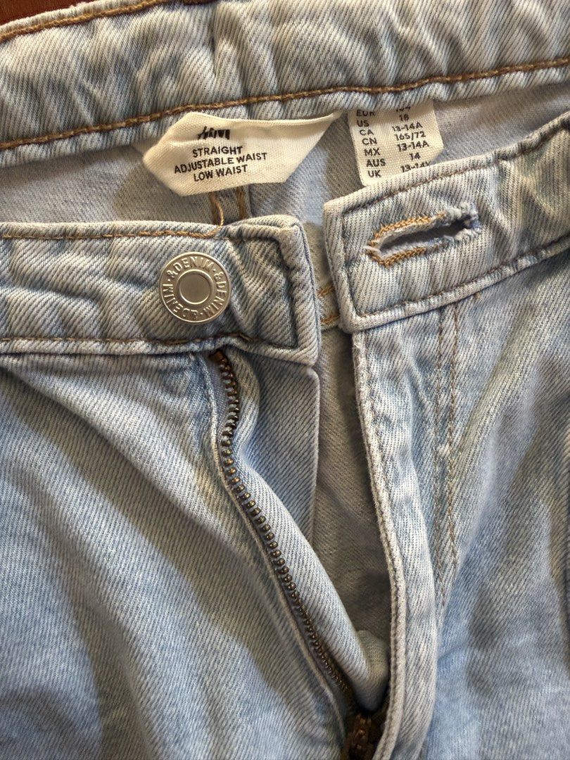 H&M Straight Adjustable Waist Jeans (Category: Jeans) located in Makati City. Submitted by larcie (Listing ID 1437612716, Image 3). Description: - H&M straight jeans - Adjustable waist - Unique patchwork design - Different shades of blue denim - Low waist - Button and zipper closure - Size: US 18, CA 18, CN 165/72, MX 14, AUS 14, UK 13-14A Can fit Small size women or 13-14Y.