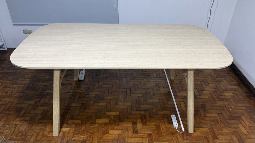 IKEA VOXLÖV (Category: Tables & Sets) located in Manila. Submitted by mcpascua (Listing ID 1437681322, Image 2). Description: - Light wood dining table - Rounded rectangular tabletop - Sturdy angled legs - Made of bamboo or similar light-colored wood - Modern and minimalist design - Suitable for dining or as a desk - Fits various interior styles.