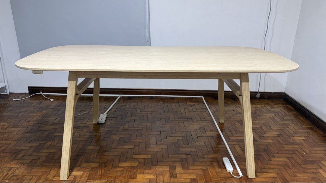 IKEA VOXLÖV (Category: Tables & Sets) located in Manila. Submitted by mcpascua (Listing ID 1437681322, Image 1). Description: - Light wood dining table - Rounded rectangular tabletop - Sturdy angled legs - Made of bamboo or similar light-colored wood - Modern and minimalist design - Suitable for dining or as a desk - Fits various interior styles.