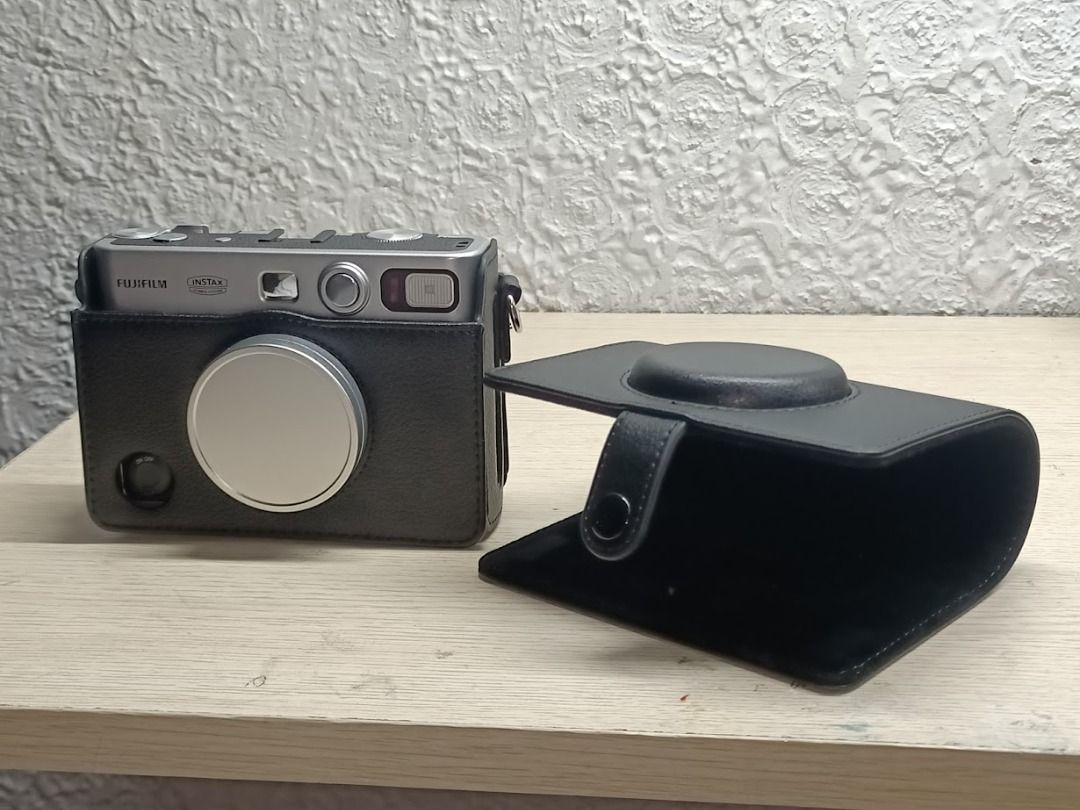 Instax Mini Evo black case magnetic cover flip (Category: Other Accessories) located in Malolos. Submitted by kairo5_ (Listing ID 1437628715, Image 3). Description: RFS: Accidentally bought two Price can be negotiated accepting Gcash only my experience with the case itself is very good, a hassle if you're gonna take pictures and the cover is just hanging... I suggest detached pag mag ppictures, attatched when kept away. Metal camera cover not inc