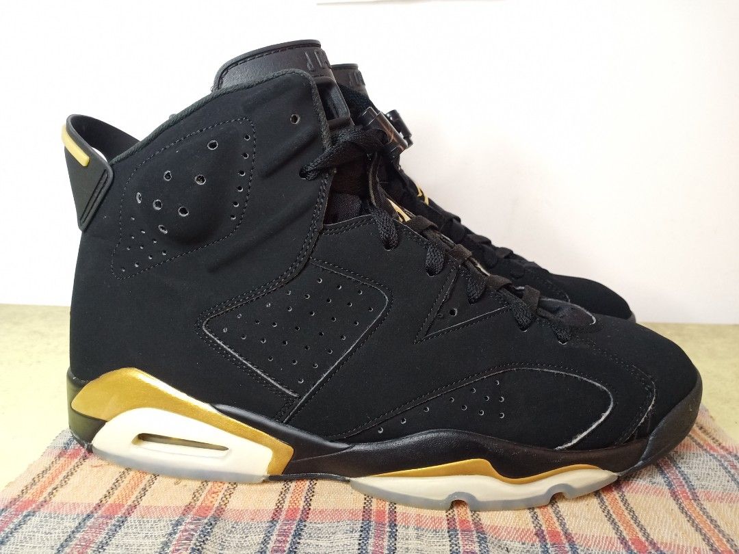 Jordan 6 DMP sz 11 (Category: Sneakers) located in General Santos City (Dadiangas). Submitted by michaelmp2026 (Listing ID 1437598356, Image 2). Description: - Jordan 6 DMP sneakers - Black upper with gold accents - Size 11 - Features Jumpman logo - Black and beige soles.
