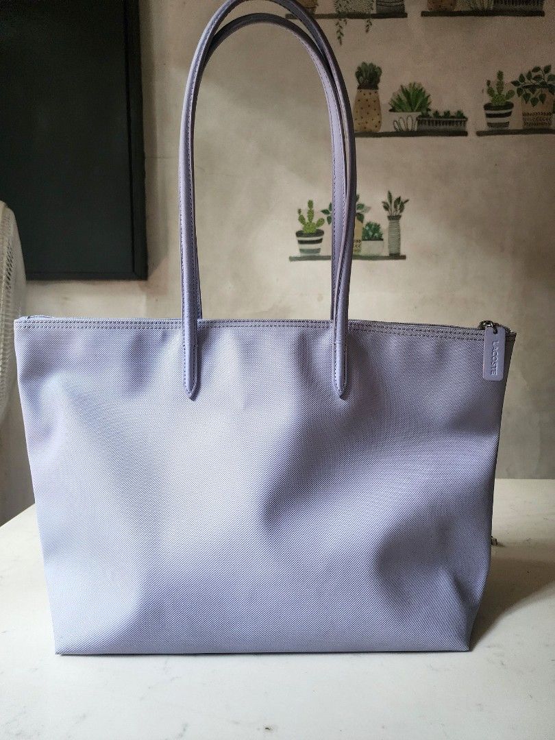 Lacoste Shopping Vertical Tote Bag (Category: Luxury Bags & Wallets) located in Quezon City. Submitted by happycheeeks (Listing ID 1437624232, Image 2). Description: authentic large size tote shoulder bag lavander / periwinkle / in pastel needs cleaning just lowered down fr 3500 thus LAST PRICE not tumi mango h&m zara marc jacobs michael kors uniqlo nike adidas new balance onitsuka Christy ng kate spade.