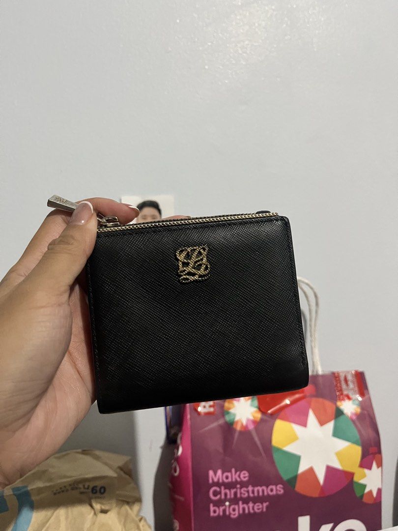 Louis Quatorze Black Wallet (Category: Wallets & Card holders) located in Quezon City. Submitted by happyleecorner (Listing ID 1437673758, Image 1). Description: - Black Louis Quatorze wallet - Gold-colored logo - Zipper closure - Multiple compartments - Clear ID slot - Made of leather - Brand: Louis Quatorze.