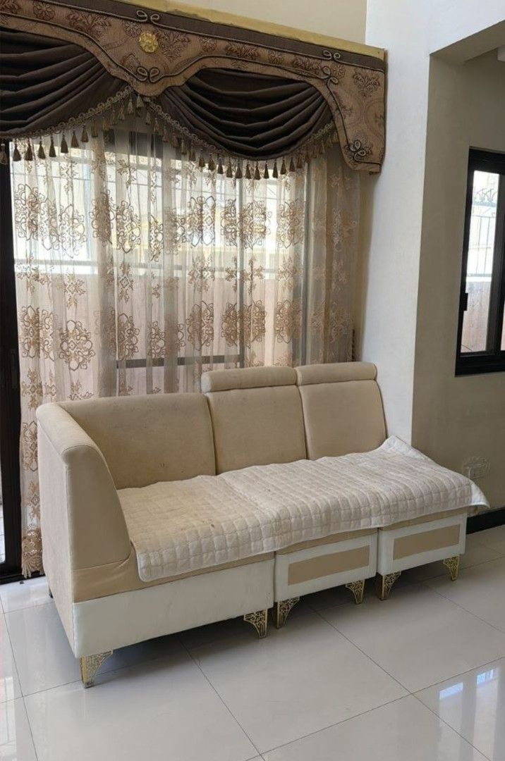 L-Shaped Sofa Set with Coffee Table (Category: Sofas) located in Pasay City. Submitted by vonneq (Listing ID 1437622490, Image 2). Description: - L-shaped sofa set with matching coffee table - Features a neutral color palette (beige and white) - Coffee table has a glass top - Well-maintained condition - Includes a three-seater sofa - Adds sophistication to any living space.