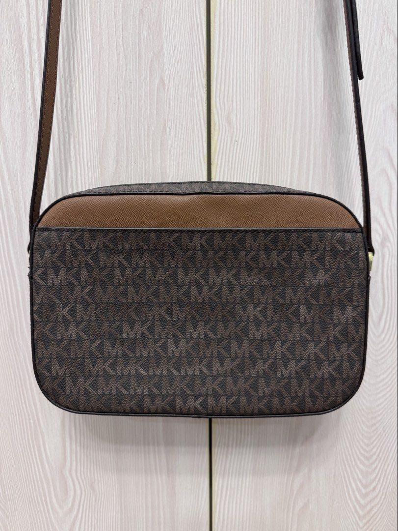 Michael Kors Jet Set Large Logo Crossbody Bag (Category: Cross-body Bags) located in Calamba. Submitted by happymom02 (Listing ID 1437717331, Image 2). Description: - Authentic Michael Kors crossbody bag - Adjustable shoulder strap - Includes care cards.