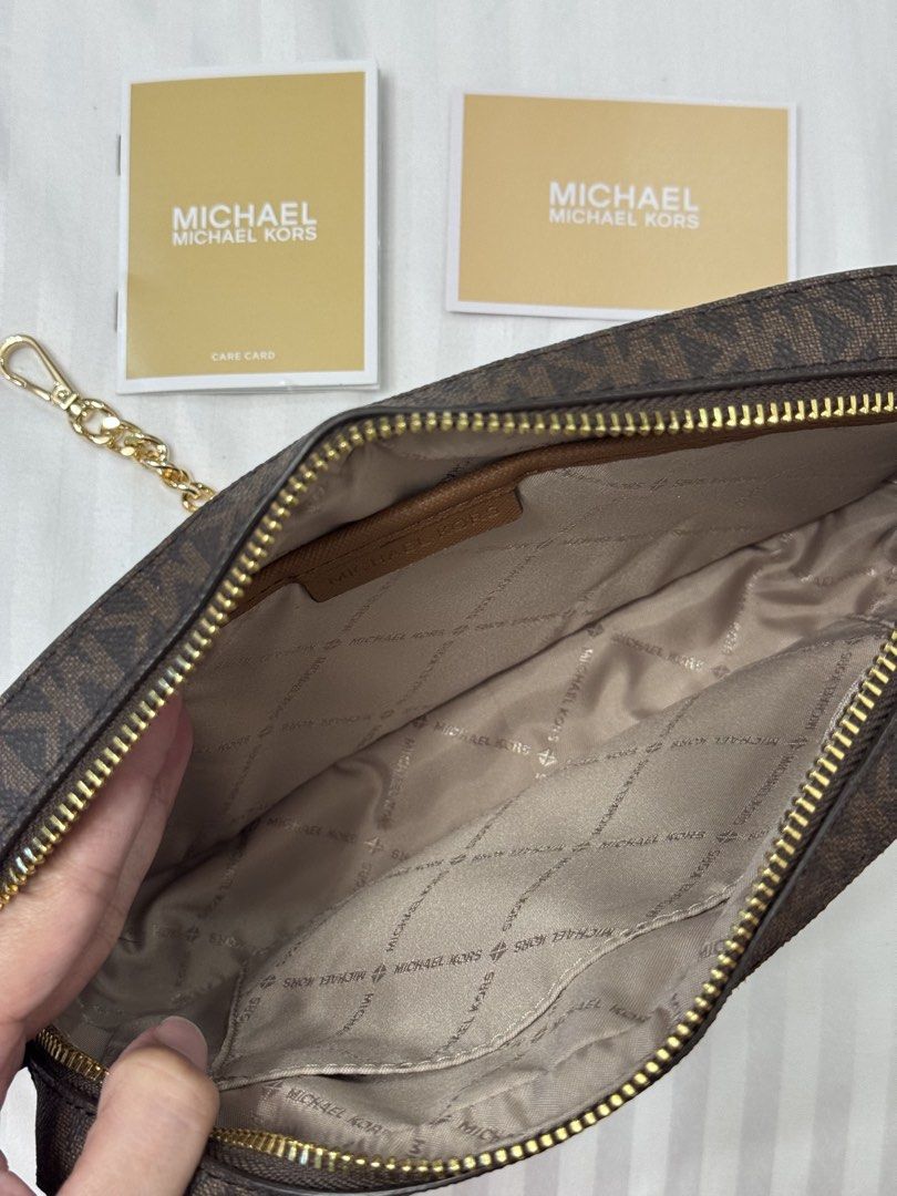 Michael Kors Jet Set Large Logo Crossbody Bag (Category: Cross-body Bags) located in Calamba. Submitted by happymom02 (Listing ID 1437717331, Image 3). Description: - Authentic Michael Kors crossbody bag - Adjustable shoulder strap - Includes care cards.