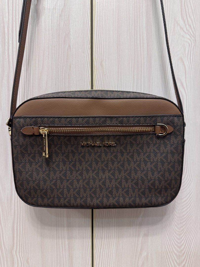 Michael Kors Jet Set Large Logo Crossbody Bag (Category: Cross-body Bags) located in Calamba. Submitted by happymom02 (Listing ID 1437717331, Image 1). Description: - Authentic Michael Kors crossbody bag - Adjustable shoulder strap - Includes care cards.