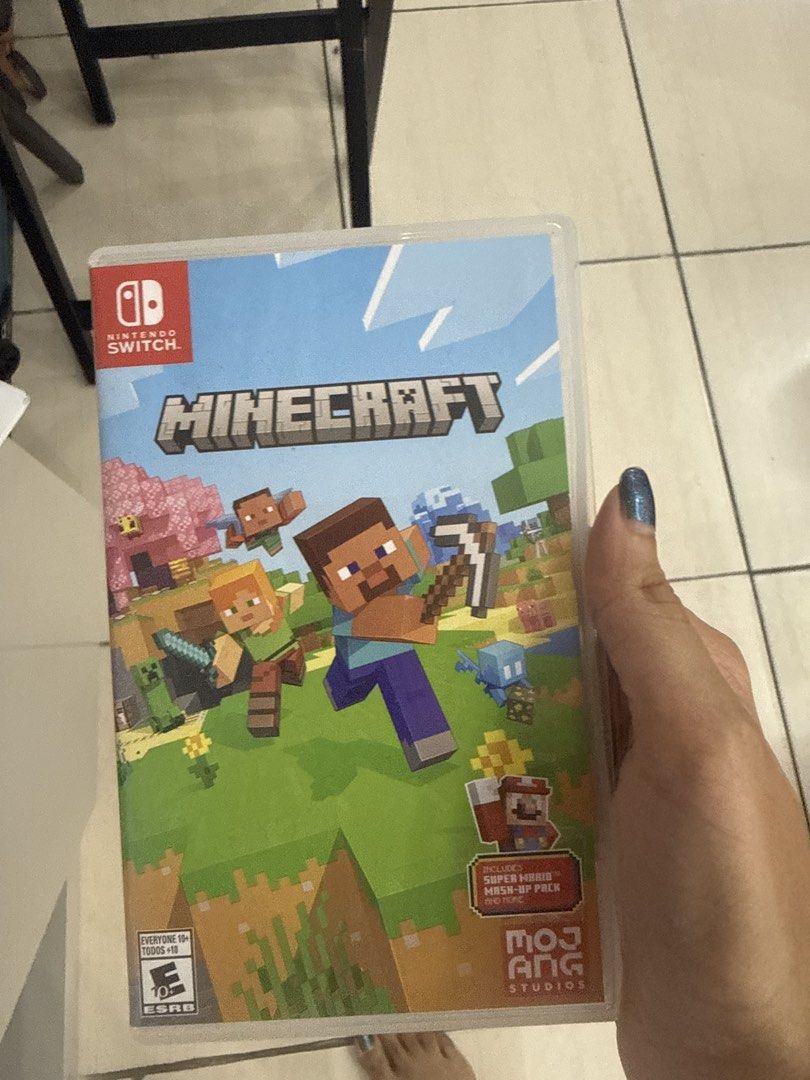 Minecraft Nintendo Switch Game (Category: Nintendo) located in Makati City. Submitted by ps_techhouse (Listing ID 1437672876, Image 1). Description: - Minecraft for Nintendo Switch - Includes Super Hero Mash-Up Pack - Published by Mojang Studios - ESRB Rating: Everyone 10+ - Game case visible.