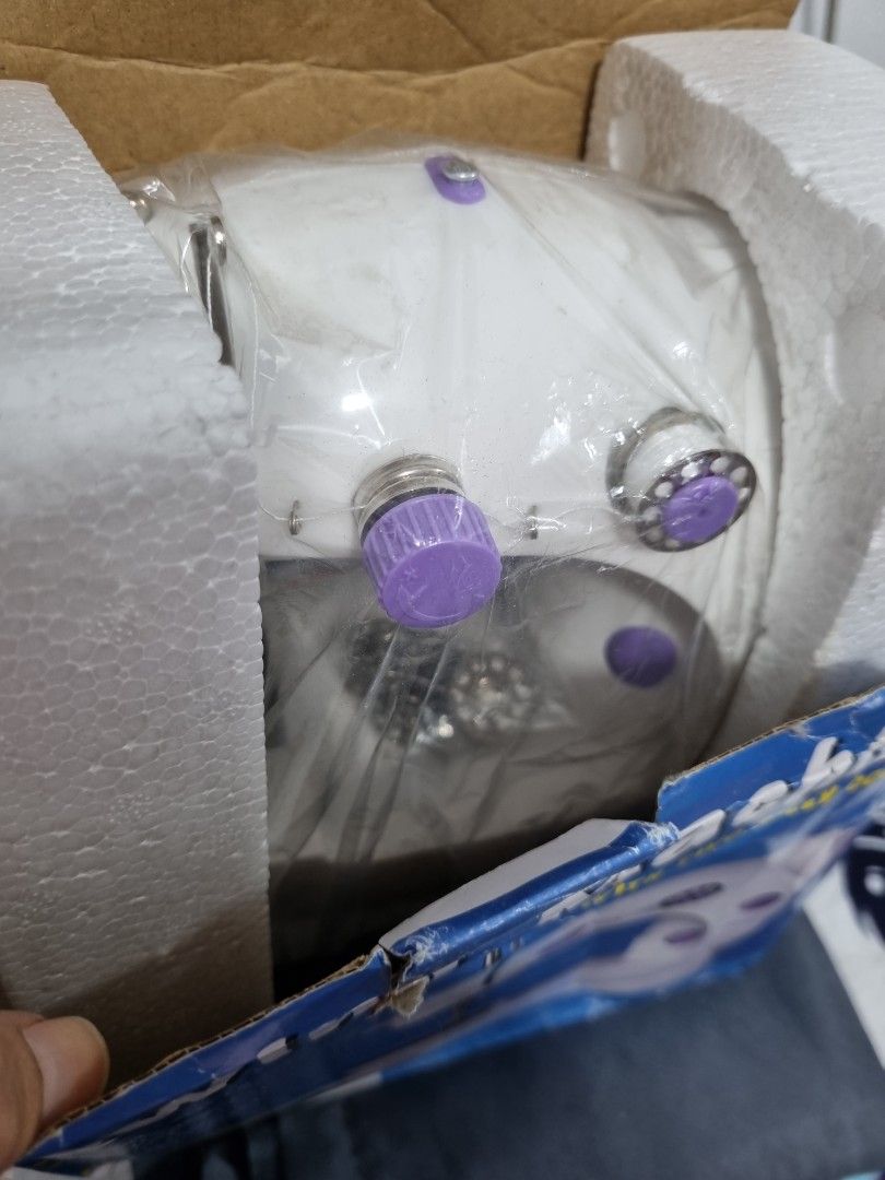 Mini Sewing Machine with Two Speed Control (Category: Other Home Appliances) located in Manila. Submitted by phcarousince2016 (Listing ID 1437715928, Image 3). Description: - Compact mini sewing machine - Dual speed and double stitch - Includes accessories - Suitable for various fabrics - Stylish purple and white color scheme - Box condition: Shows wear and tear.