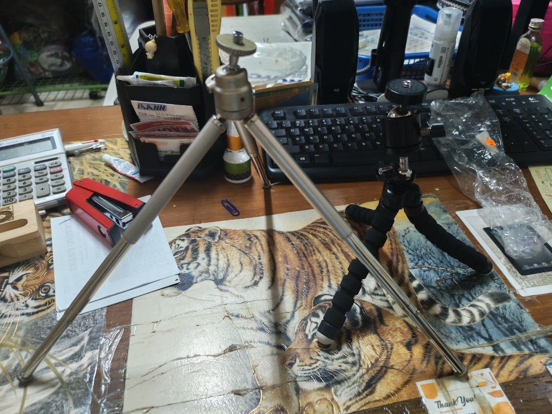 Mini Tripod Set buy 1 take 1 metal (Category: Tripods & Monopods) located in Manila. Submitted by GentleGiant (Listing ID 1437676150, Image 1). Description: - Two mini tripods included - Silver tripod: adjustable legs, ball head - Black tripod: flexible, foam-covered legs, ball head - Designed for small cameras and phones - Compact and ideal for tabletop use.