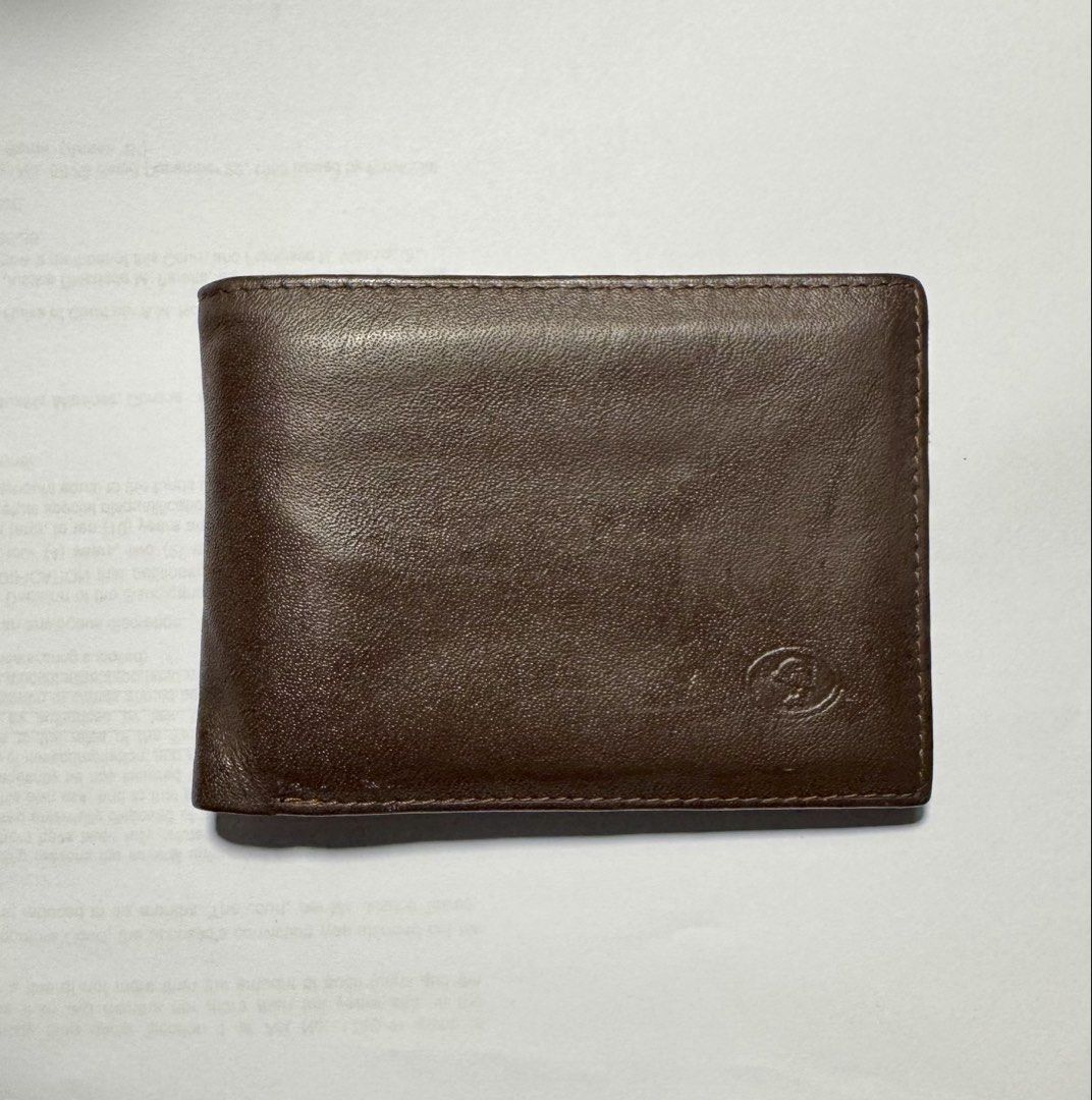 MJIM Classic Brown Leather Wallet (Category: Wallets & Card holders) located in Makati City. Submitted by ja_declutters (Listing ID 1437607798, Image 1). Description: - Genuine brown leather wallet - Classic bi-fold design - Features multiple card slots - Includes a clear ID window - Adorned with the MJIM Classic logo - Light-colored interior lining - AUTHENTIC/ORIGINAL.