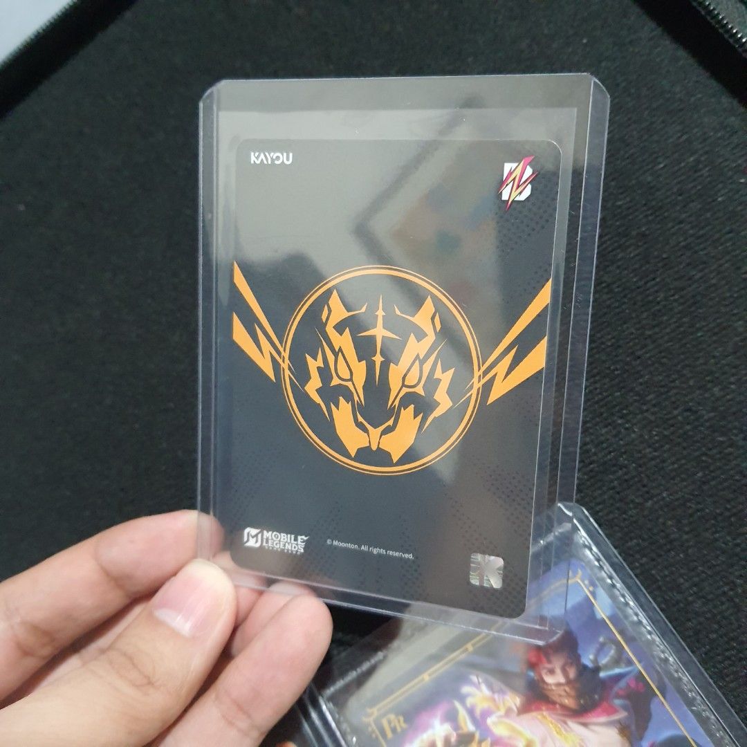 Mobile Legends: Bang Bang Trading Card (Category: Raw Singles) located in Las Pinas. Submitted by gabbuencam69723 (Listing ID 1437747329, Image 2). Description: - Collectible trading card - Features a vibrant character design - Holographic finish - Includes protective sleeve - "KAYU" logo on the back - Likely a limited edition card.