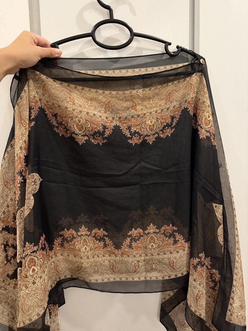 MOVING OUT SALE! Paisley Print Scarf (Category: Scarves) located in Paranaque City. Submitted by mandsss21 (Listing ID 1437726325, Image 1). Description: - Black rectangular scarf - Paisley print in brown and beige - Sheer and lightweight fabric - Adds a touch of sophistication.