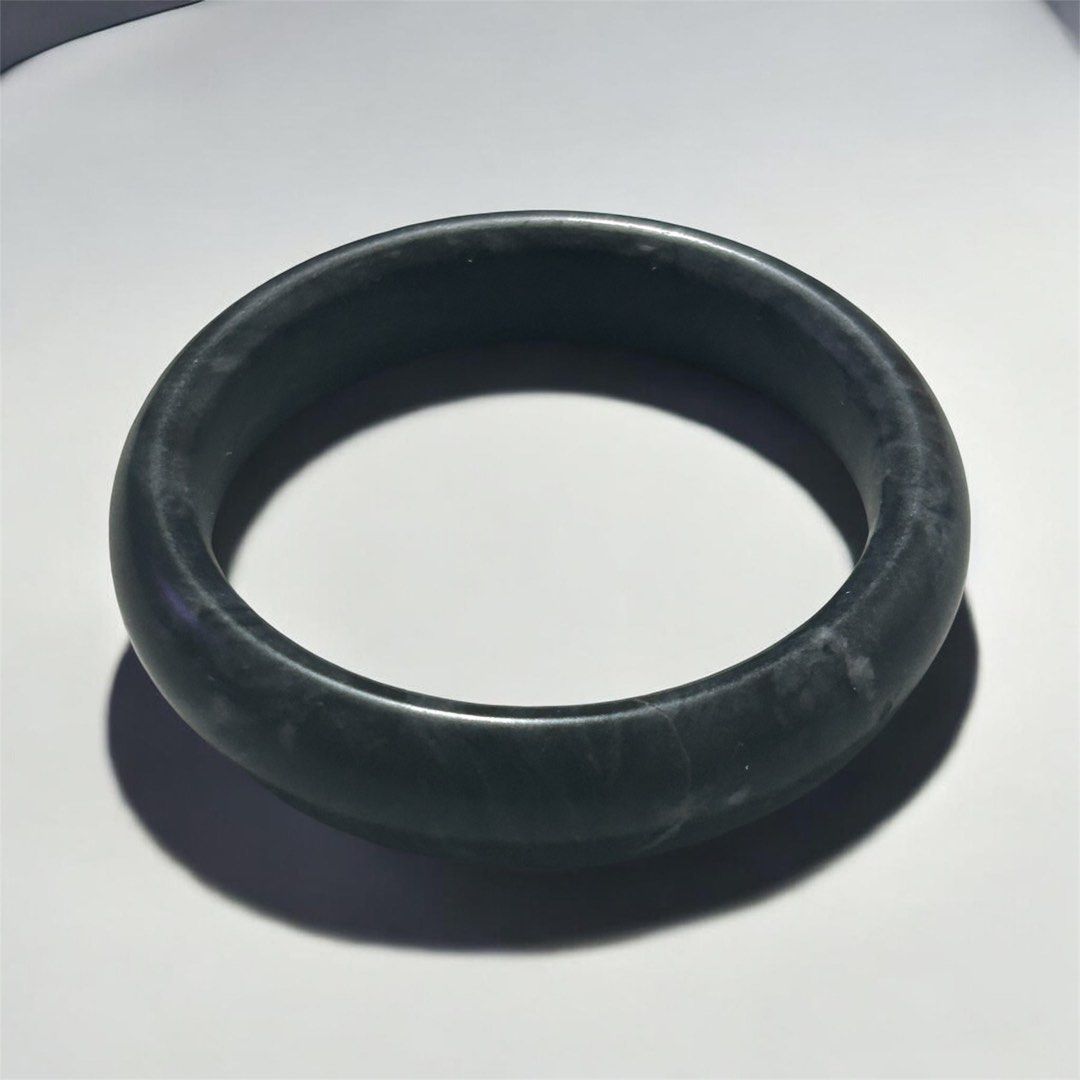 natural black or dark grey jadeite bangle bracelet (Category: Bracelets) located in Angeles City. Submitted by zyeplustradings (Listing ID 1437649879, Image 1). Description: natural black or dark grey jadeite bangle bracelet (often referred to as Wuji or “black ink” jadeite). This type of jewelry is highly valued for its deep, smoky tone, smooth polished finish, and structural density Medium:approximately 56.5mm diameter .