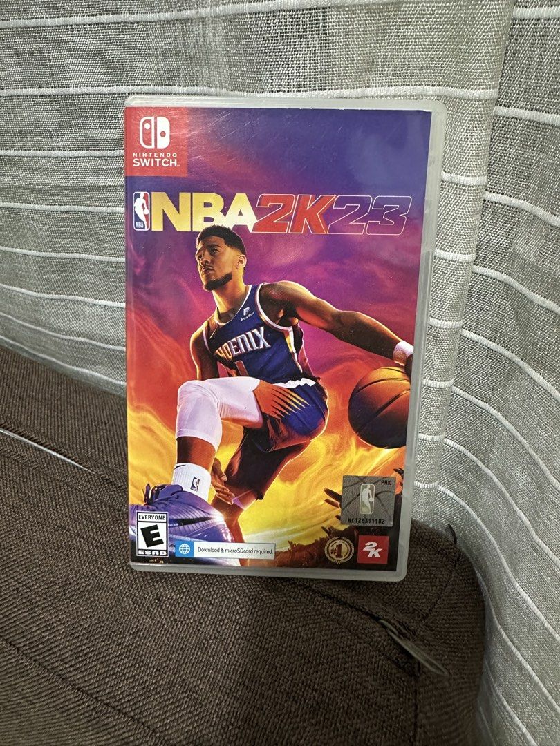 NBA 2K23 - Nintendo Switch (Category: Nintendo) located in Manila. Submitted by bei10 (Listing ID 1437718297, Image 1). Description: - NBA 2K23 for Nintendo Switch - Features the game title and Nintendo Switch logo - Game cover features a basketball player in a Phoenix Suns jersey - Rated "E" for Everyone - Download or microSD card required.