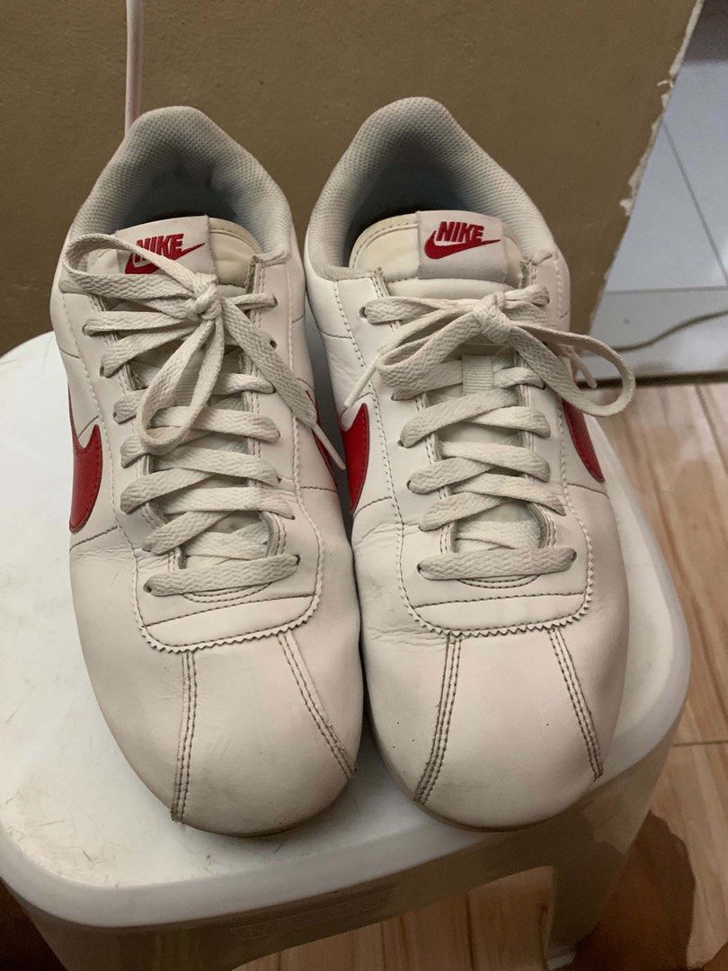 Nike Cortez White Red Sneakers (Category: Sneakers) located in Manila. Submitted by kimsanorjo03985 (Listing ID 1437630473, Image 3). Description: - Classic Nike Cortez - White with red accents - Iconic Nike swoosh - Nike logo on heel - White laces - Blue stripe on sole.