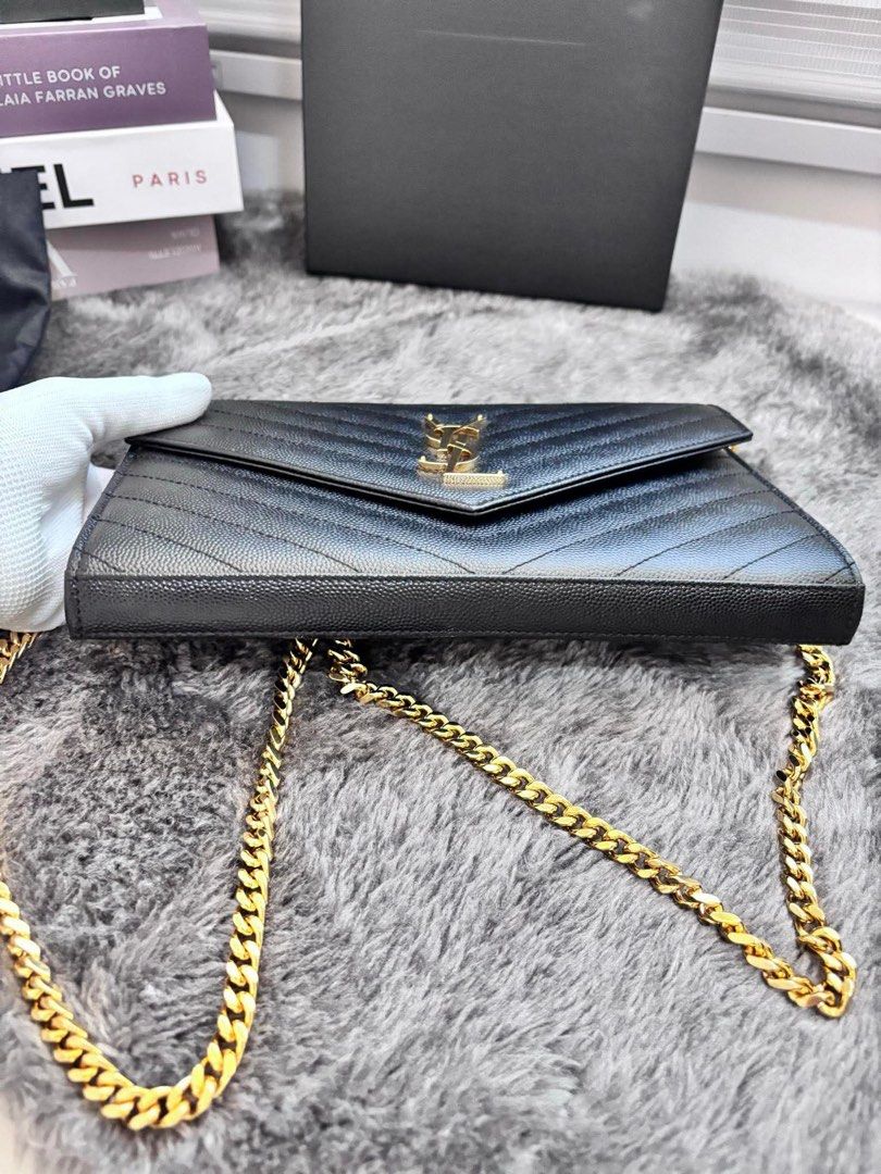 Original YSL Cassandre Envelope Chain Wallet WOC in Large Grained Leather (Category: Luxury Bags & Wallets) located in Manila. Submitted by shopwithbrilliantadel (Listing ID 1437749944, Image 2). Description: Good Condition Guaranteed authentic or your money back Complete Set with Receipt, no paperbag With authenticity certificate from Koibito Korea .