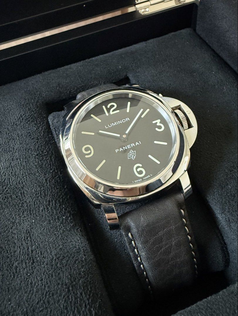 Panerai Luminor PAM01000 (Category: Men's Watches) located in Manila. Submitted by mnlwatchsociety (Listing ID 1437629406, Image 3). Description: The Panerai Luminor PAM01000 strips the Panerai formula down to its purest form. No date. No seconds. No unnecessary clutter. Just the unmistakable Luminor silhouette, the signature crown guard, and a clean black dial with oversized luminous numerals that made Panerai a cult favorite among collectors. A