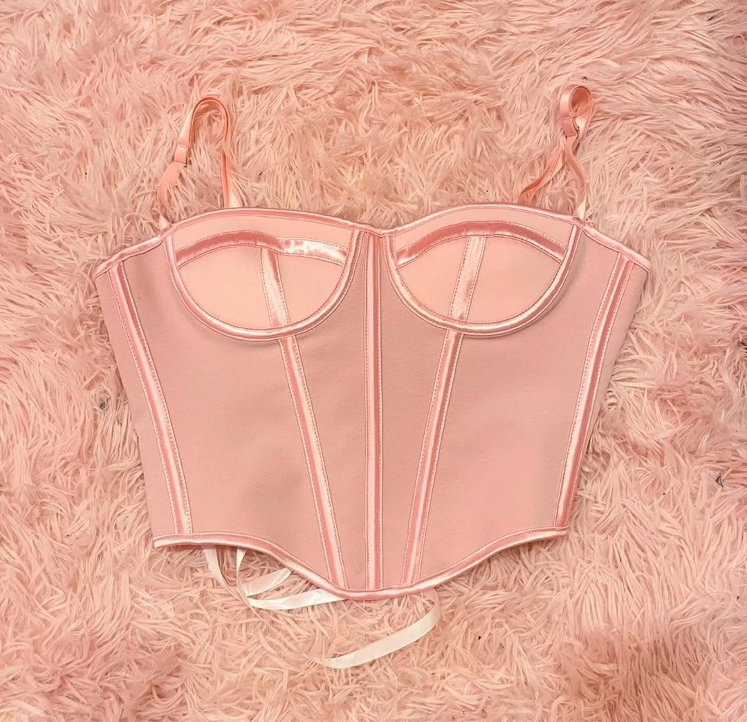 Pink Corset Top (Category: Others Tops) located in Pasay City. Submitted by songjia_ (Listing ID 1437683174, Image 1). Description: - Pink corset top - Adjustable straps - Satin trim - Boning details - Sweetheart neckline - Flattering silhouette - Perfect for special occasions.
