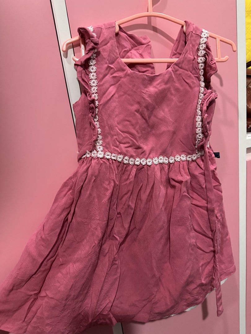 Pink Ruffled Dress with White Lace (Category: Babies & Kids Fashion) located in Pasig City. Submitted by wisemomph (Listing ID 1437699868, Image 1). Description: As is, used twice only. - Pink dress with white lace neckline and sleeves - Ruffled design - Flowing skirt - Tie details on the sides - Ideal for special occasions or everyday wear.