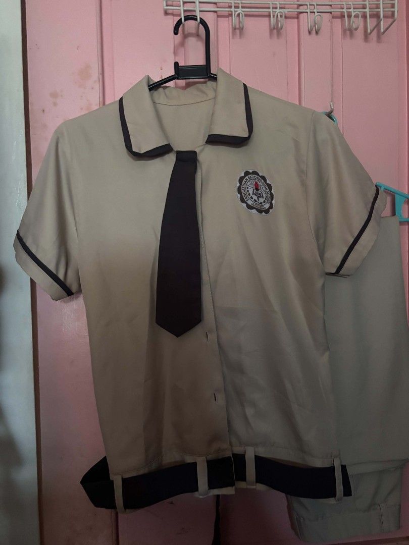 PNHS SHS School Uniform Set (Category: Sets or Coordinates) located in Lingayen. Submitted by brulee21 (Listing ID 1437608396, Image 1). Description: - Complete school uniform set (Pangasinan NHS SHS) - Includes: beige short-sleeved blouse with black trim, matching tie, and black pleated skirt - Top features school logo can fit size M-L Bust 36 Waist line 27-28 Height 5'5.