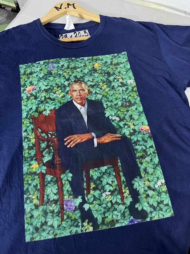 Port & Company Obama Graphic Tee - Large (Category: Tshirts & Polo Shirts ) located in Baguio. Submitted by cosmicgem_21b525 (Listing ID 1437710930, Image 2). Description: - Navy blue t-shirt - Size: Large - Brand: Port & Company - Graphic: Barack Obama seated on a chair with foliage - Style: Crew neck, short sleeves - Material: Cotton.