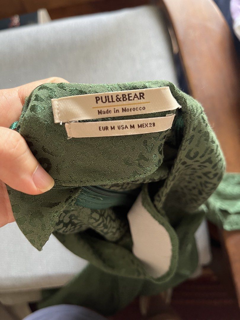 Pull&Bear Emerald Green Dress (Category: Dresses) located in Pasig City. Submitted by TrishODeclutter (Listing ID 1437716257, Image 2). Description: - Pull&Bear green dress - Long sleeves - Round neckline - Subtle leopard print - Size: M - Made in Morocco - Zipper closure at the back RFS: Decluttering pre-pregnancy clothes Location: Pasig, near Tiendesitas (buyer books for pick up).