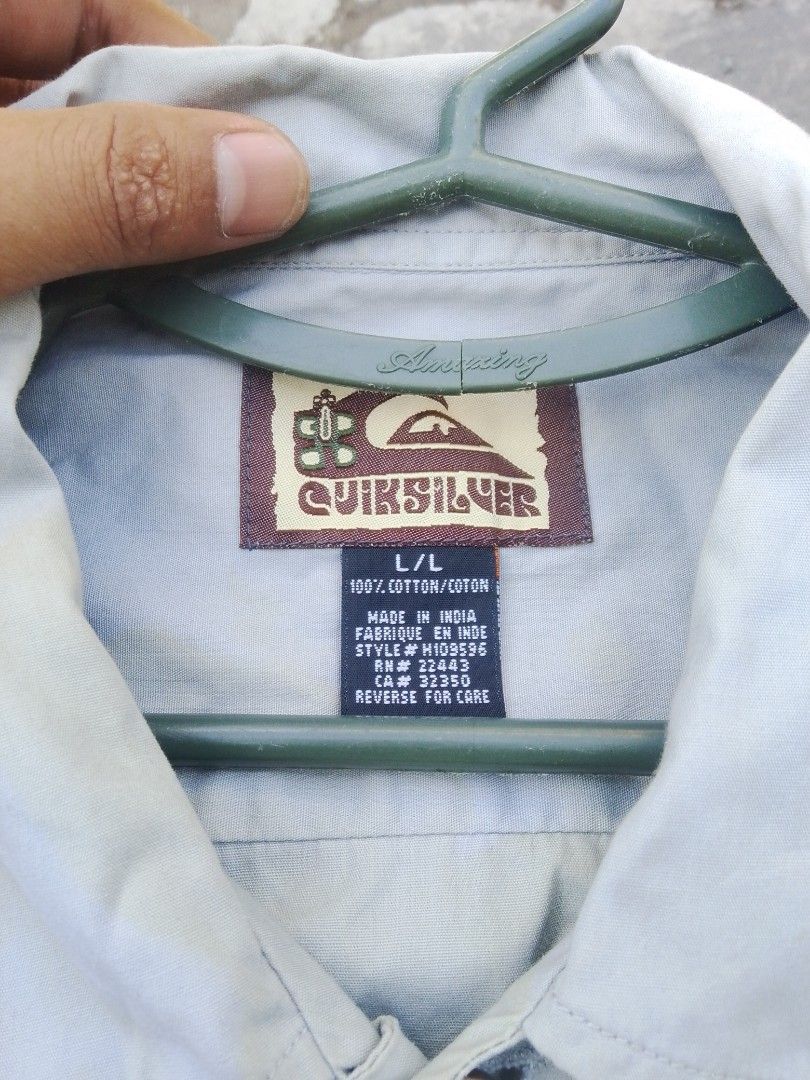 Quiksilver Dragon Print Shirt (Category: Tshirts & Polo Shirts ) located in Quezon City. Submitted by theoneshop1 (Listing ID 1437743451, Image 3). Description: - Quiksilver shirt - Unique dragon print - Button-down closure - Collared neckline - Light color with blue dragon detailing - Size: L/L - Made in India - Classic, casual style.