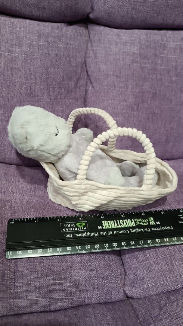 Retired Jellycat Rock-a-Bye Kitten (Category: Plushies & Soft Toys) located in Quezon City. Submitted by fabricatebycp (Listing ID 1437728399, Image 3). Description: Adorable retired Jellycat Rock-a-Bye Kitten in a white basket. The stuffed animal has closed eyes and a soft, plush texture. The basket has two handles and a woven design. The toy is small and can be easily carried around..