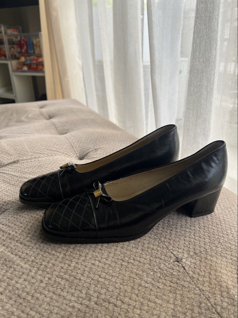 Salvatore Ferragamo Black Quilted Heels (Category: Heels) located in Makati City. Submitted by esila.essentials (Listing ID 1437602873, Image 2). Description: Salvatore Ferragamo heels - Color: Black - Design: Quilted toe with bow detail - Hardware: Gold-tone - Heel: Block heel - Size: 7 1/2 - Made in Italy - Condition: Some wear on soles.