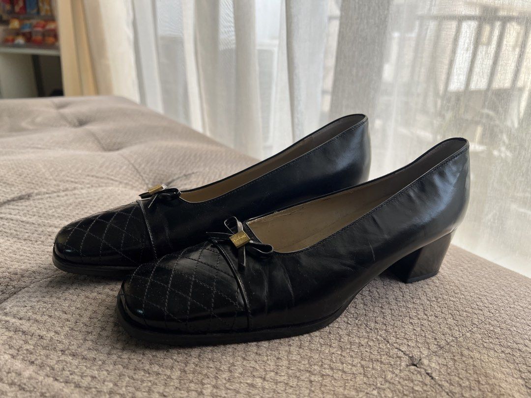 Salvatore Ferragamo Black Quilted Heels (Category: Heels) located in Makati City. Submitted by esila.essentials (Listing ID 1437602873, Image 3). Description: Salvatore Ferragamo heels - Color: Black - Design: Quilted toe with bow detail - Hardware: Gold-tone - Heel: Block heel - Size: 7 1/2 - Made in Italy - Condition: Some wear on soles.