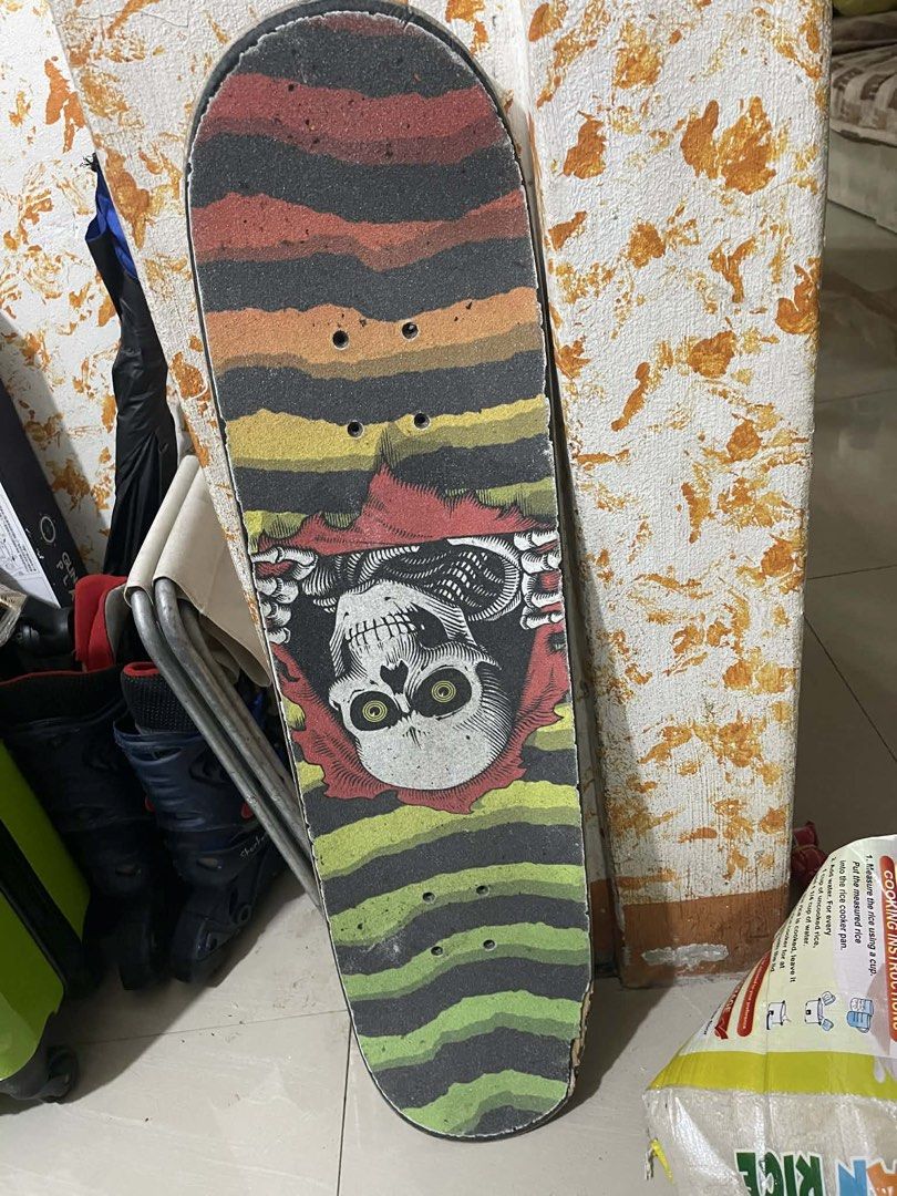 Santa Cruz Skateboard (Category: Skates, Rollerblades & Scooters) located in Dasmarinas. Submitted by curruptdot (Listing ID 1437593710, Image 1). Description: - Santa Cruz skateboard - Features a skull graphic on the deck - Rose design with Santa Cruz logo on the underside - Classic skateboard shape - Grip tape is present - DECK ONLY.
