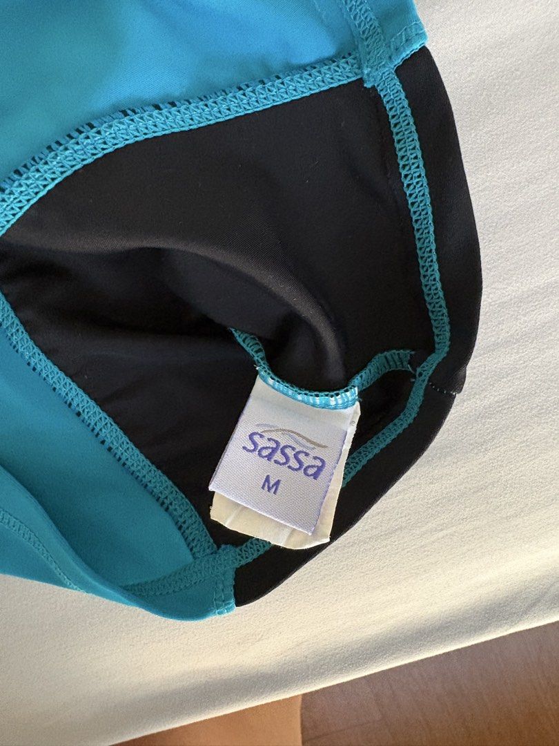 Sassa Rashguard - Size M (Category: Rash guard) located in Angeles City. Submitted by classictop (Listing ID 1437733809, Image 2). Description: - Size M rashguard - Features a blue front panel - Black side panels - Patterned sleeves - High neckline - Short sleeves - Perfect for water activities.