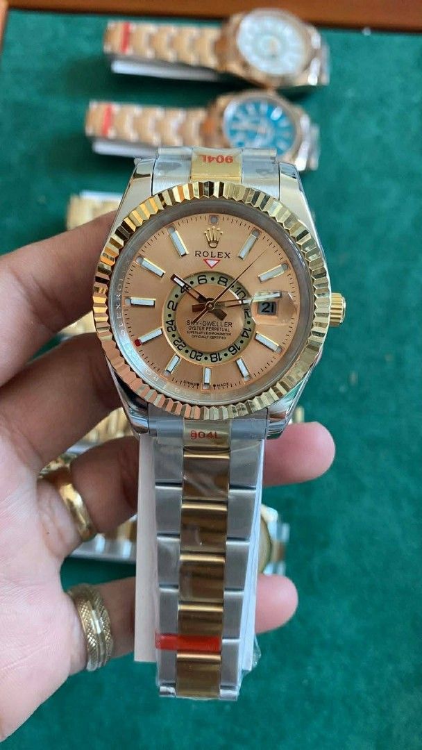 Sky-Dweller Watch (Category: Luxury Watches) located in Manila. Submitted by kaneramos031818 (Listing ID 1437603003, Image 3). Description: Rolex Sky-Dweller watch. Features a fluted bezel, date display, and second time zone. Gold and silver-tone bracelet. Iconic Rolex crown logo..