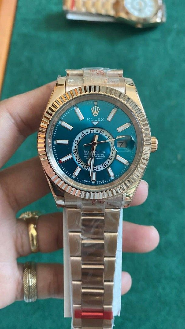 Sky-Dweller Watch (Category: Luxury Watches) located in Manila. Submitted by kaneramos031818 (Listing ID 1437603003, Image 2). Description: Rolex Sky-Dweller watch. Features a fluted bezel, date display, and second time zone. Gold and silver-tone bracelet. Iconic Rolex crown logo..