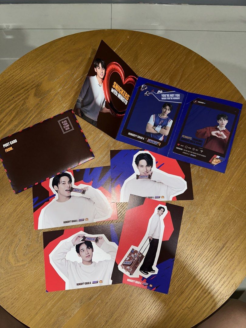 Snickers with Mingyu Postcard Set & Transparent Card (Category: K-Wave Merchandise) located in Quezon City. Submitted by camiscloset_ (Listing ID 1437691114, Image 1). Description: Inclusions: - Snickers Postcard Set [Lightly Used] - Transparent Card (bought during the Snickers with Mingyu Pop Up) [BRAND NEW].