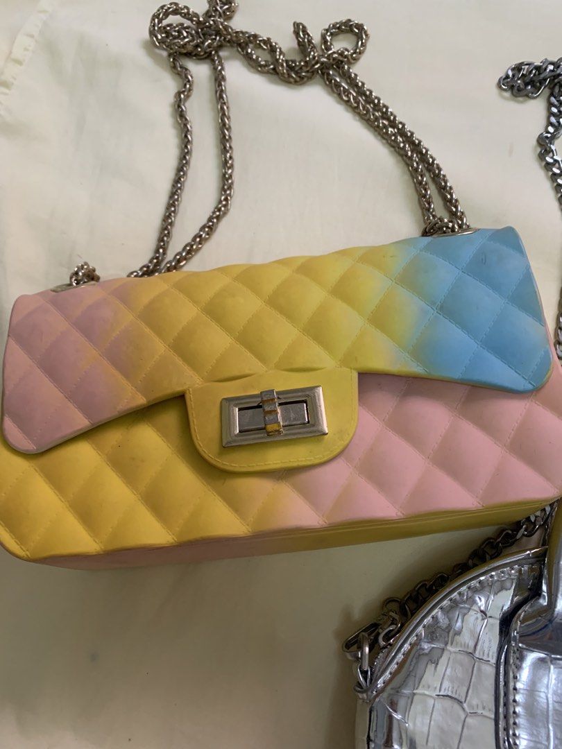 Take Two Silver Croc Handbag & Pastel Chain Bag (Category: Luxury Bags & Wallets) located in Manila. Submitted by leigh_dior (Listing ID 1437662597, Image 2). Description: Two stylish handbags are available. One is a silver, crocodile-textured handbag with a top handle and chain strap. The other is a pastel-colored chain bag with a quilted design. Both bags have chain straps. The pastel bag features a color gradient from pink to yellow to blue..